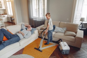 boy-cleaning-the-living-room-3890165